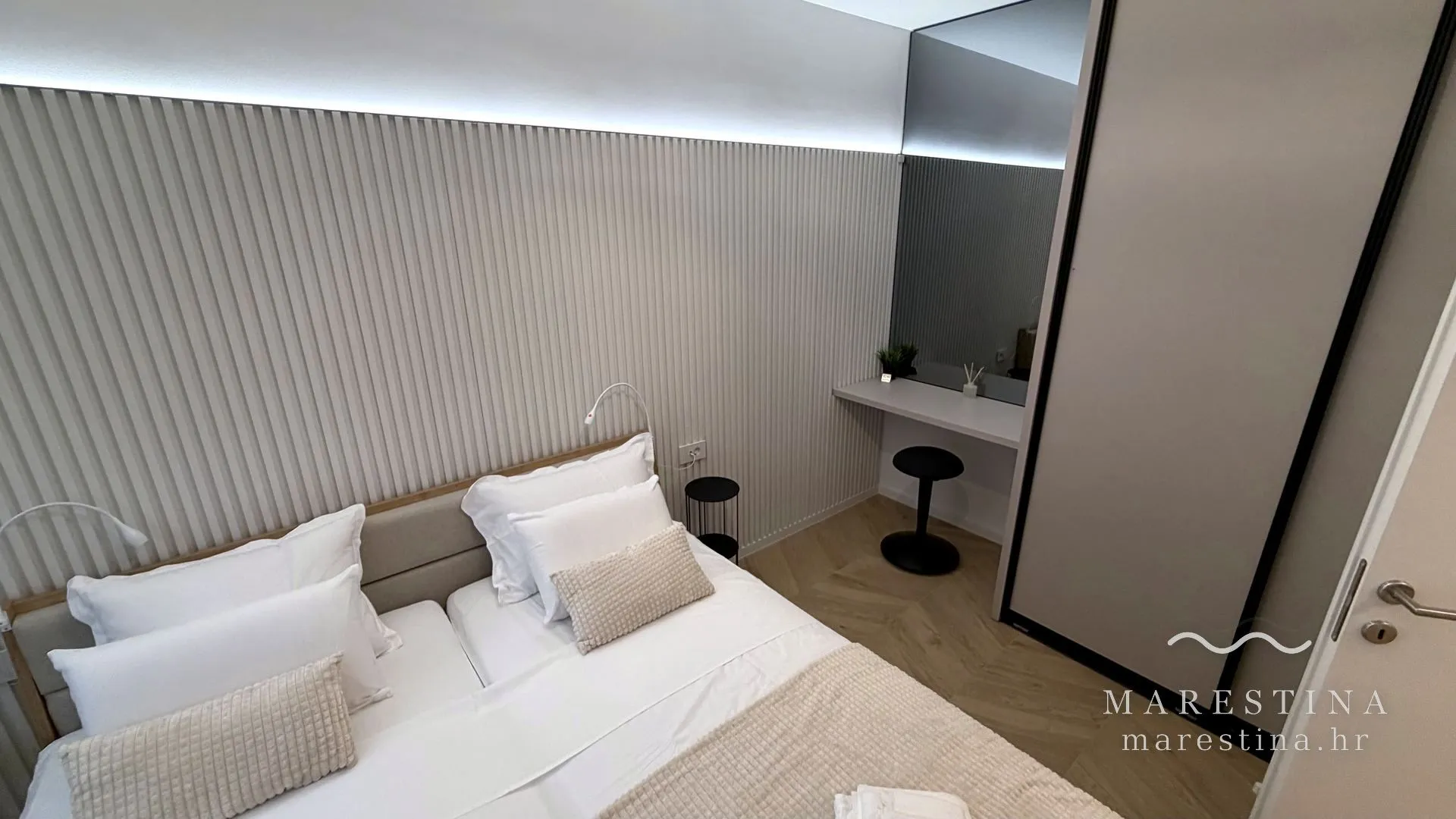 Second bedroom with double bed, wardrobe and workspace
